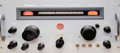 Rack-mounted radio receiver with  7 small knobs, 2 large knobs, a meter and a slide-rule dial