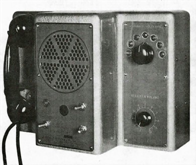 Rack-mounted radio receiver with a speaker grill, 5 small knobs,  a tuning-knob, multiple push-buttons and slide-rule dial
