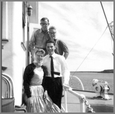 Photo of Tom Drake and Ray Heimberger with two young lady passengers on the SS South American