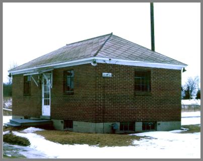 Photo of the exterior of WAD's brick station building